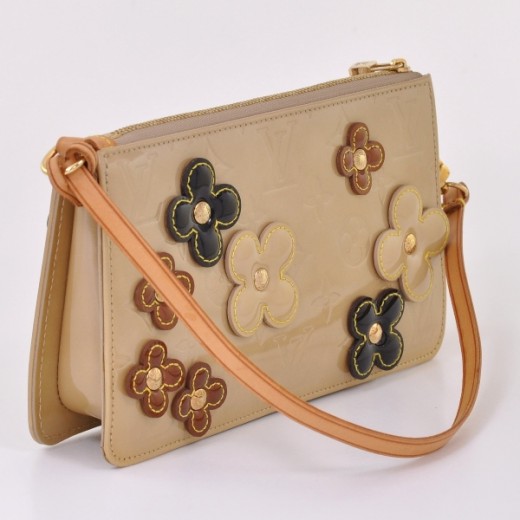 Artsy leather handbag Louis Vuitton Beige in Leather - 31119137