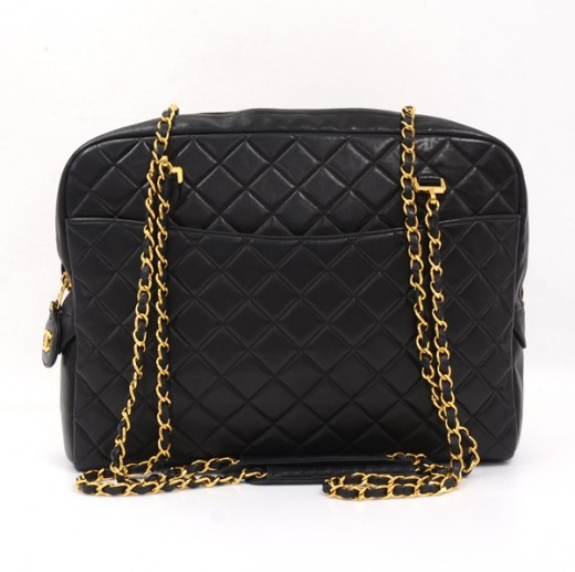 black side bag with gold chain