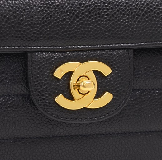 Sold at Auction: Chanel - a V-stitch flap shoulder bag in black caviar  leather, circa 1991, rectangular body with chevron and vertical quilt,  fastens with interlocking CC turn-lock, gold-tone hardware, leather and