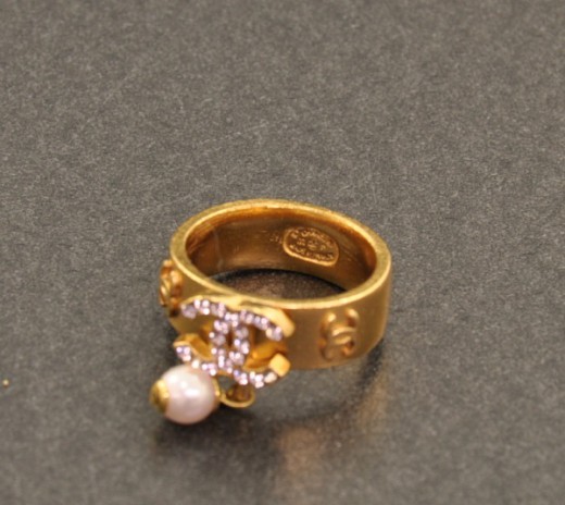 Chanel Chanel Ring Gold tone CC Logo with pink line stones