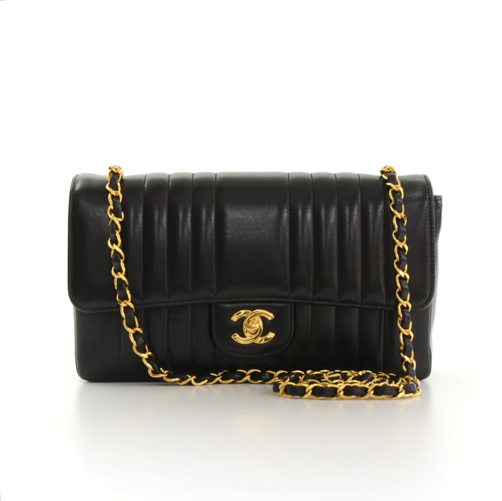 Chanel vertical quilted bag store