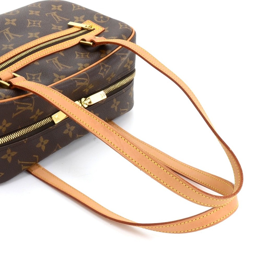 LOUIS VUITTON MONOGRAM CITE SHOULDER BAG, traditional brown monogram canvas  with leather trim and pale gold tone hardware, double zip closure at the  top and zippered front pocket, 25cm x 18cm H