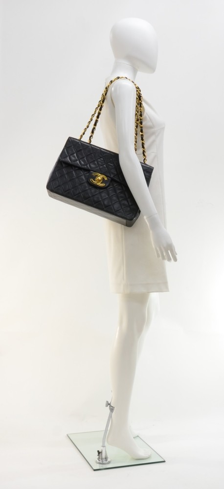 Vintage Chanel maxi jumbo big logo bag in black lambskin leather and gold  hardware