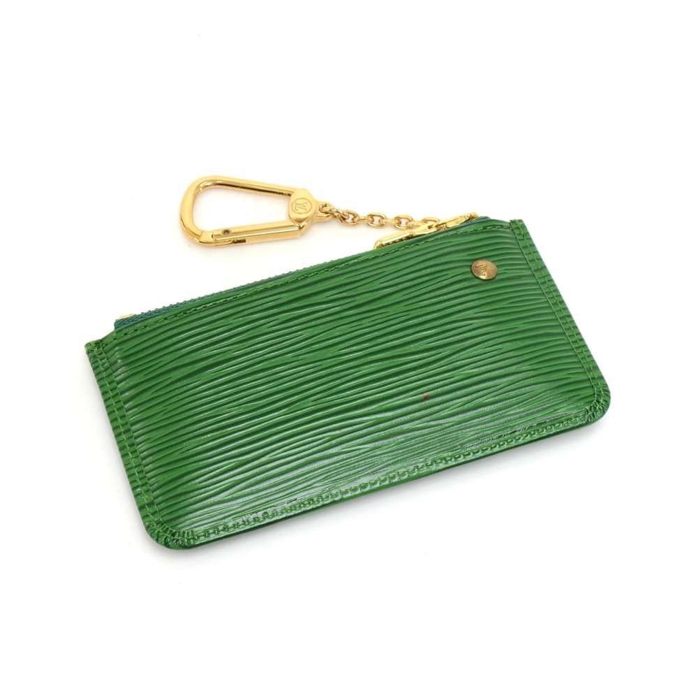 Louis Vuitton, Three Louis Vuitton Epi Leather articles including a yellow  cosmetics pouch, a green pencil case and a green key holder