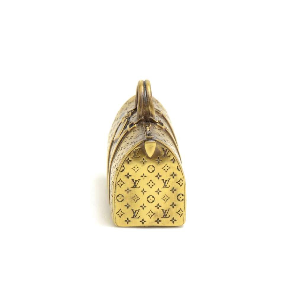 Louis Vuitton, Gold Tone Keepall Paperweight. - Bukowskis