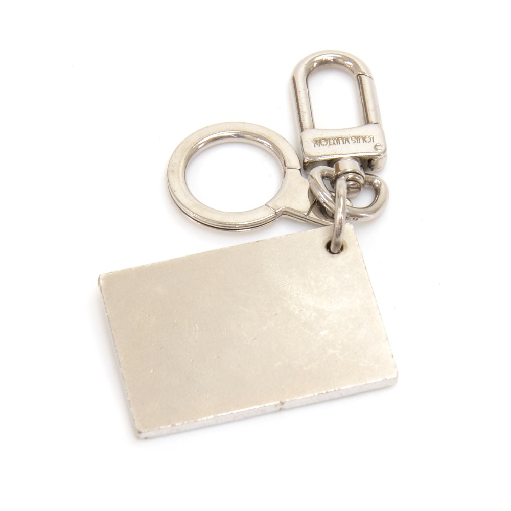 LOUIS VUITTON Silver Tone Metal Travelling Requisites Paris Embossed Key  Ring at 1stDibs