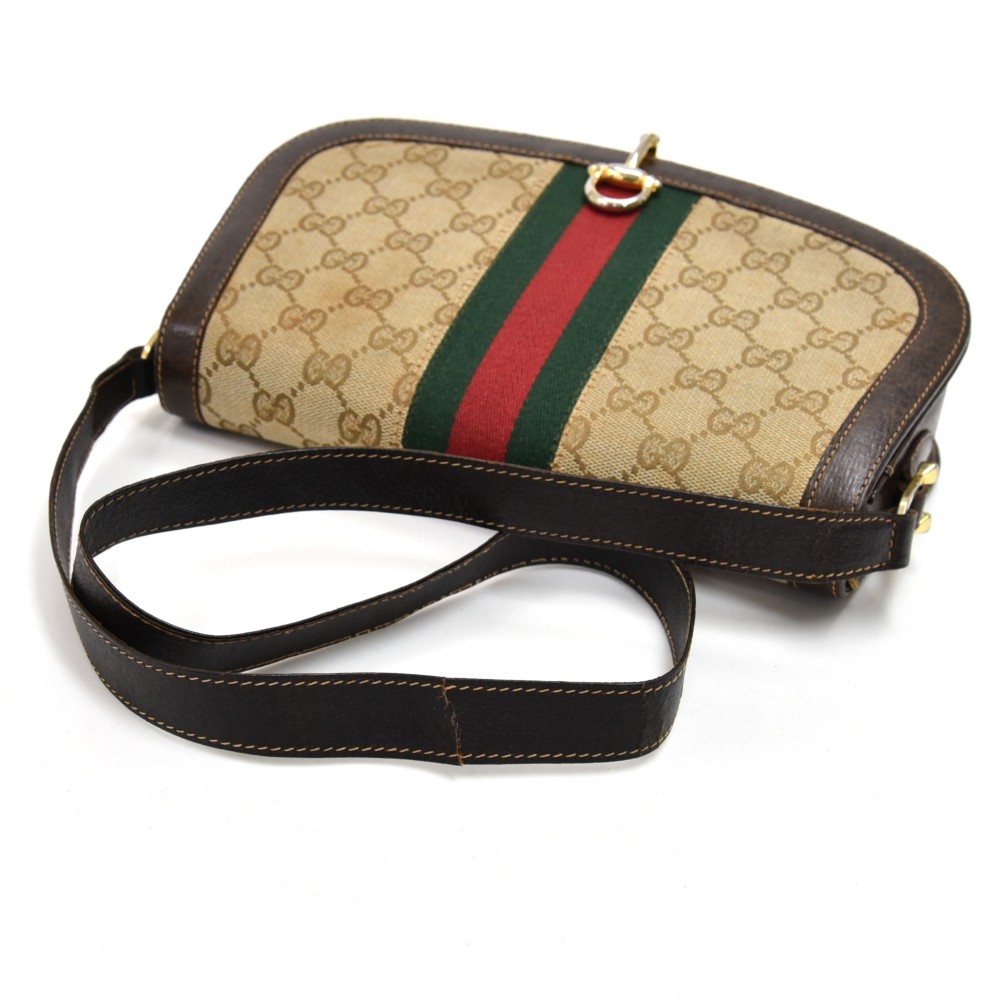 Gucci, a vintage Gladstone bag, designed with a cream canvas exterior, tan  leather trim, brushed gol