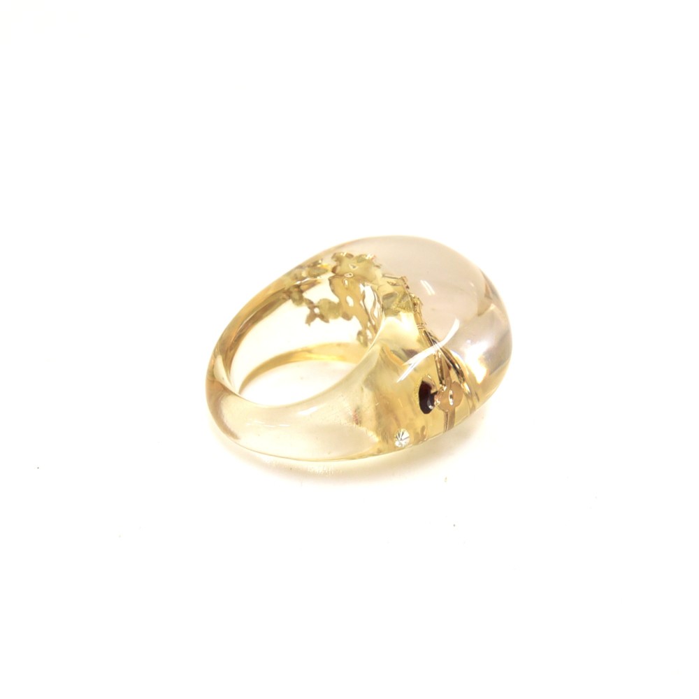 A LOUIS VUITTON LUCITE AND GOLD LEAF RING, the bombe style clear coloured  ring inset with gold leaf details including initials LV and flower head  details. In Louis Vuitton box. Ring size
