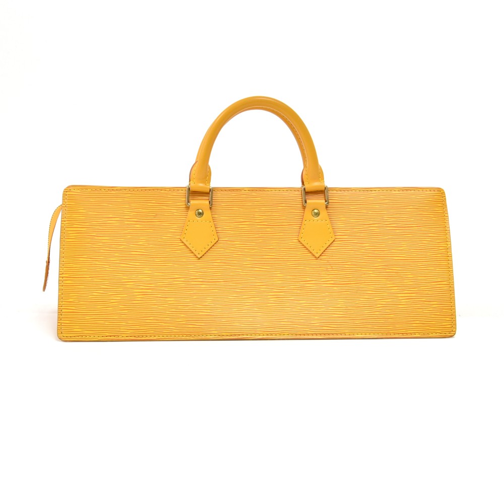 LOUIS VUITTON TASSIL YELLOW EPI LEATHER SAC TRIANGLE HANDBAG, geometric  shape, with purple leather lining, two top handles, zip closure at the top,  40cm x 16cm H x 14cm.