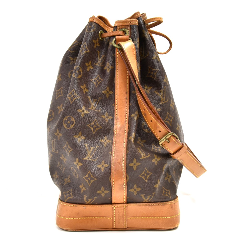 LOUIS VUITTON VINTAGE NOE MONOGRAM BUCKET BAG, leather trims and adjustable  shoulder strap, cord closure, brown fabric lining and brass tone hardware,  26cm x 34cm H x 18cm.