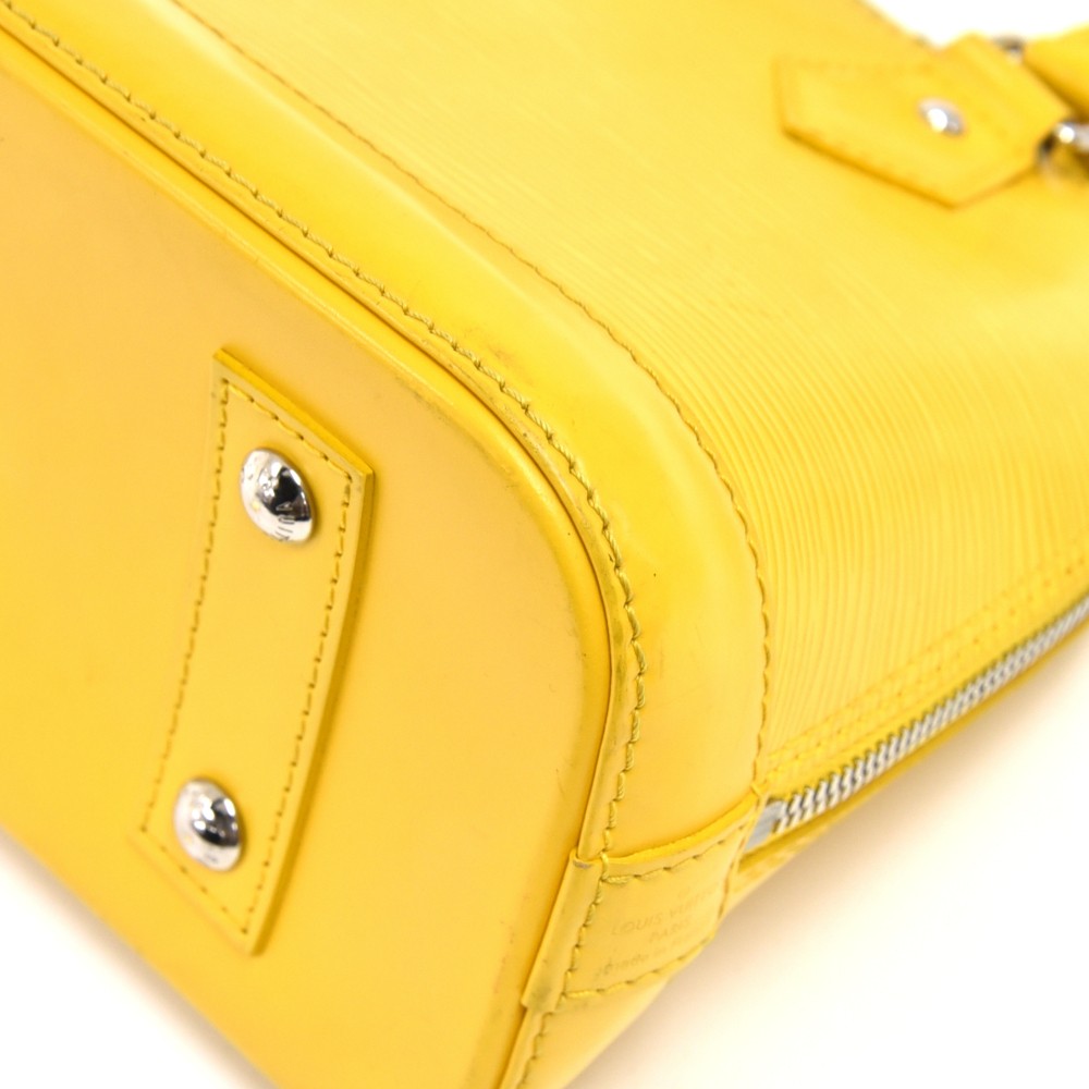 Alma bb leather handbag Louis Vuitton Yellow in Leather - 35049115