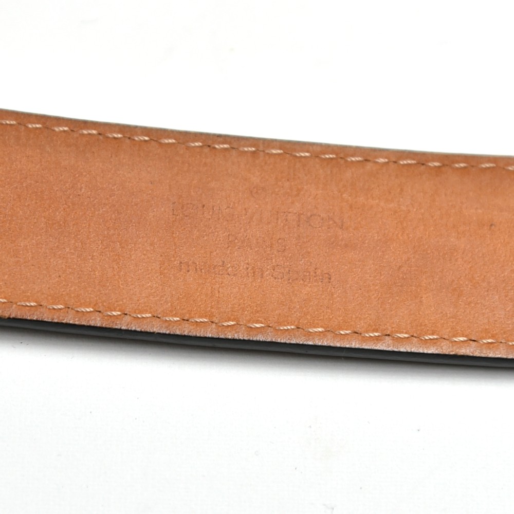 LOUIS VUITTON. Black epi leather belt, LV buckle in silv…