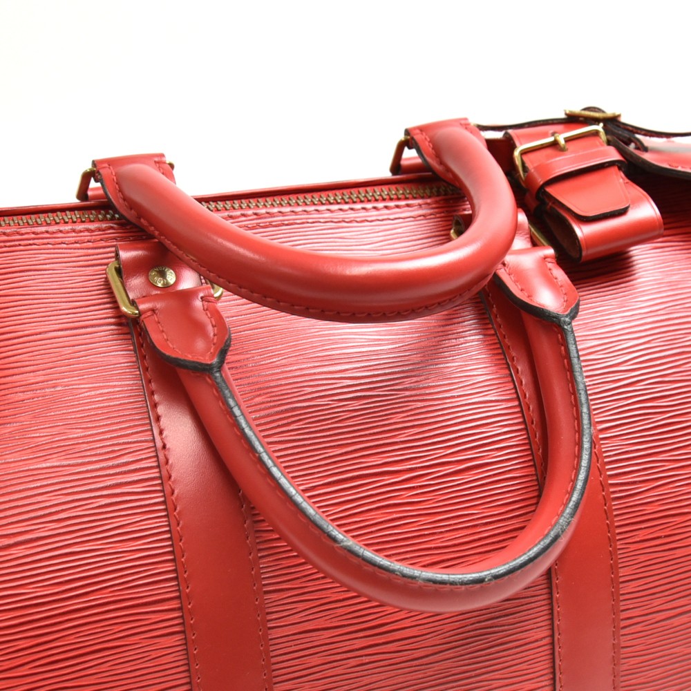 Louis Vuitton, A Red Epi Leather Keepall travel bag. - Bukowskis